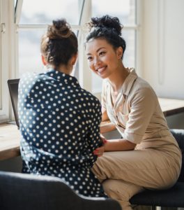 Two professional women talking