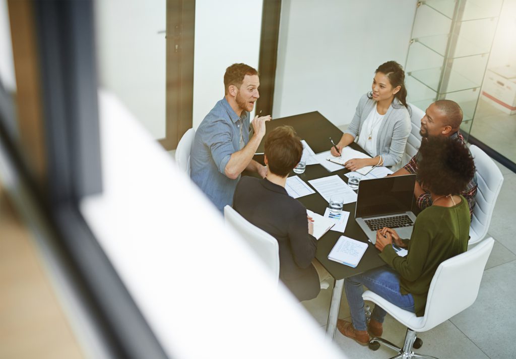 Team of colleagues meeting to discuss ideas