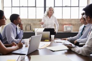 Woman leading a meetinh